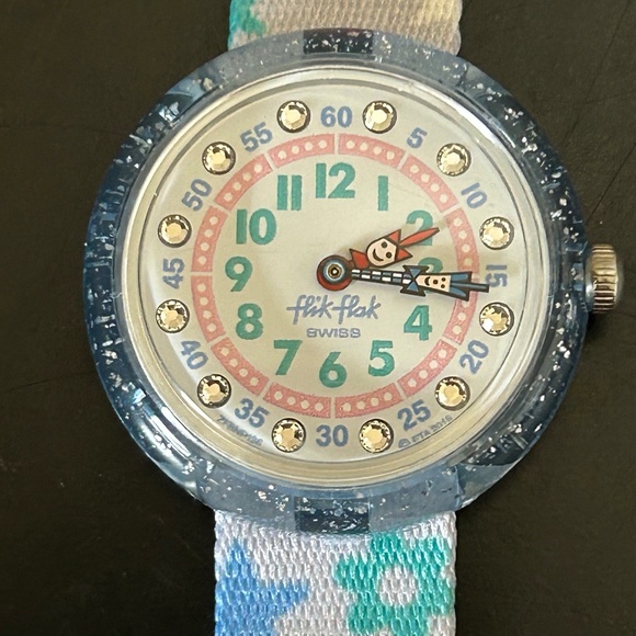 FlixFlax Swatch Watch with plastic case andpaper work. New Battery .